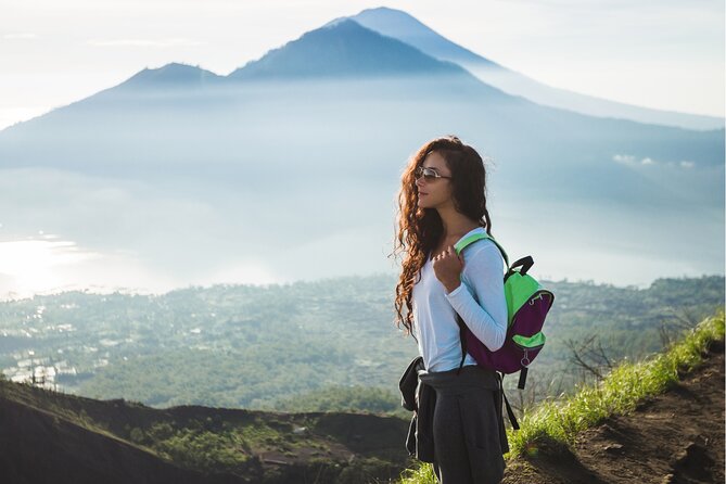 Bali: Guided Mount Batur Sunrise Trekking and Natural Hot Spring Tour - After sunrise: Lake Batur views, lava and black sand crossing