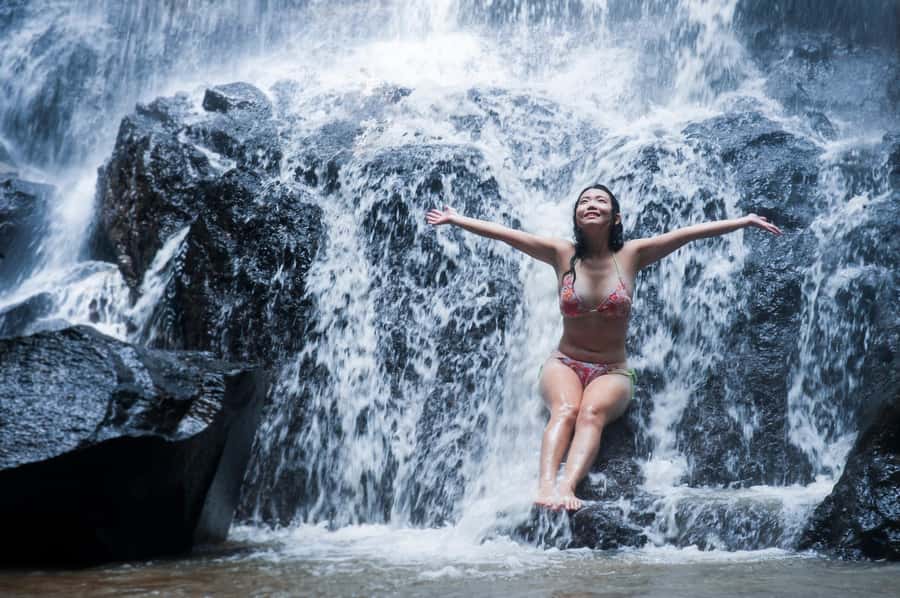Bali Waterfall Tour with Lunch Views of Mount Batur - Kanto Lampo Waterfall: tiered rocks, misty photos, and a shallow dip