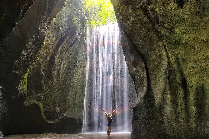 Mount Batur Sunrise Trekking and Hidden Waterfall - Tukad Cepung waterfall inside a cave, and why late morning works